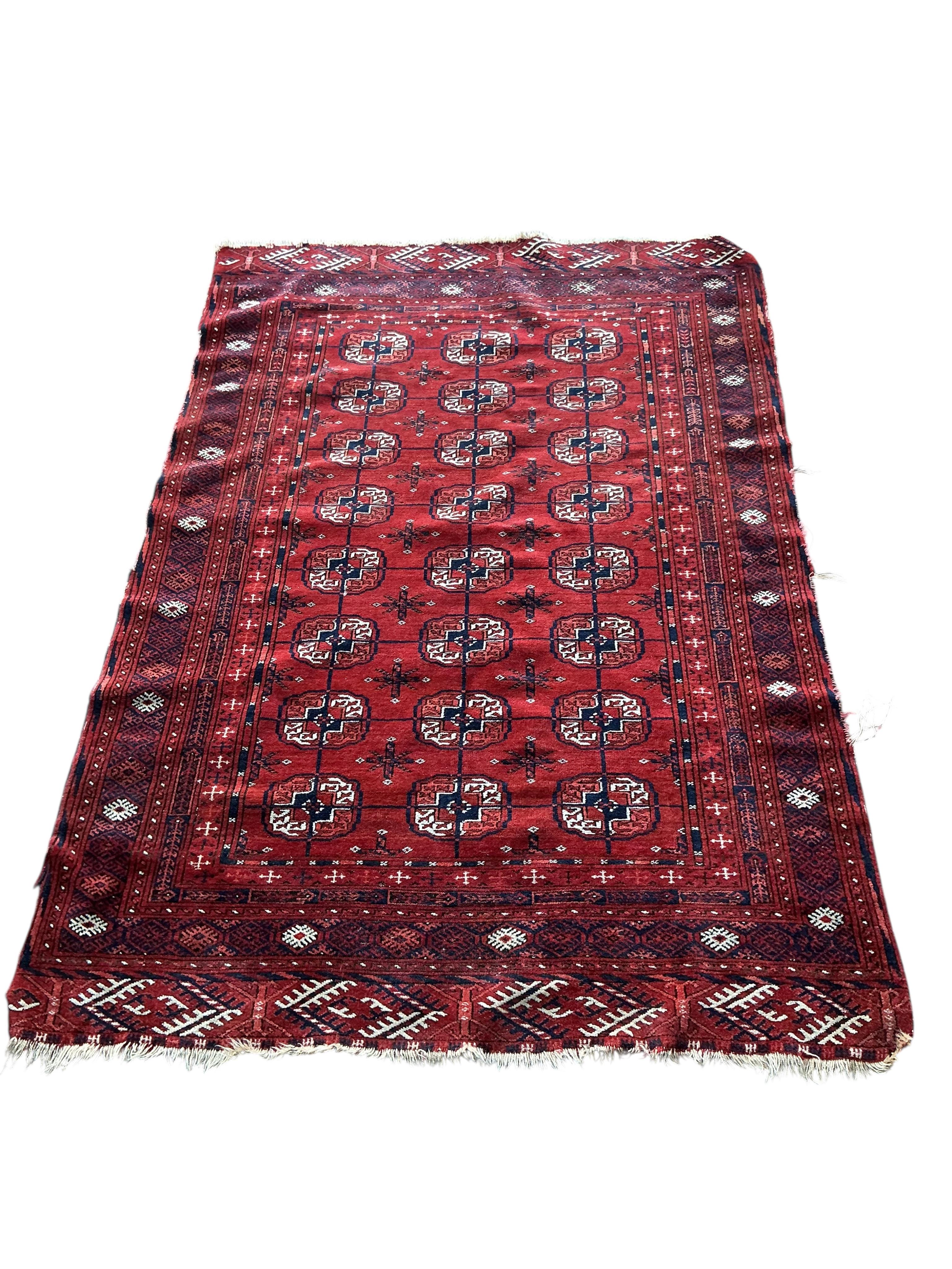A Bokhara red ground rug, 155 x 108cm